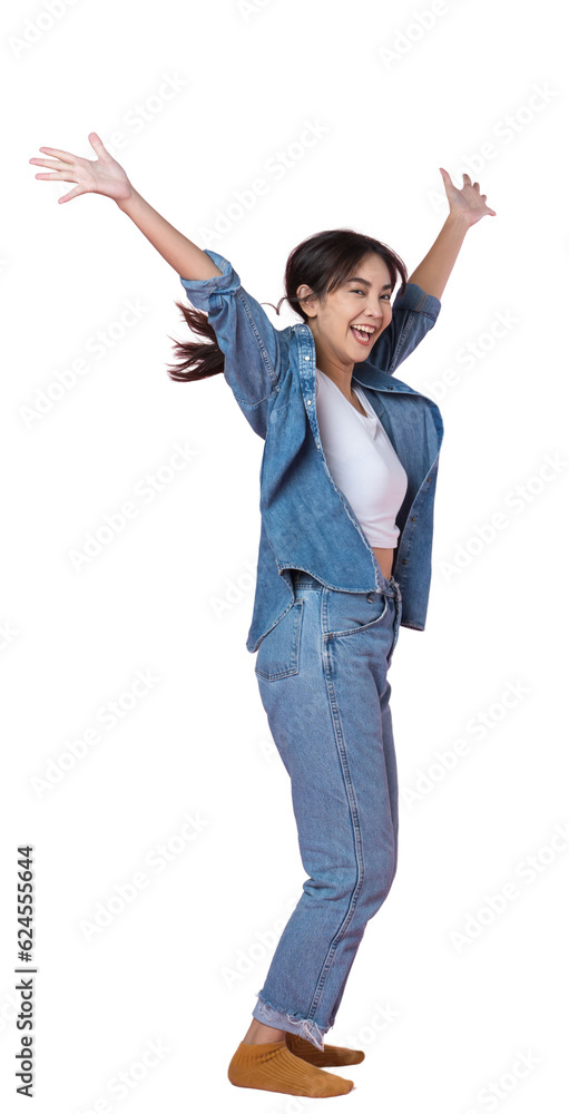 Elegant young Asian woman raises her arm and leg in a studio shot, expressing happiness and success 