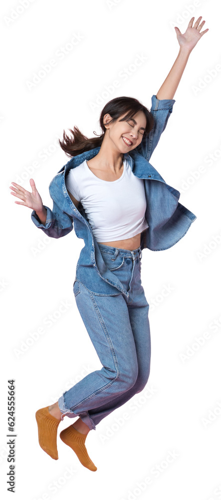 Elegant young Asian woman raises her arm and leg in a studio shot, expressing happiness and success 