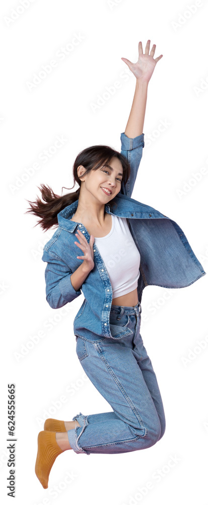 Elegant young Asian woman raises her arm and leg in a studio shot, expressing happiness and success 