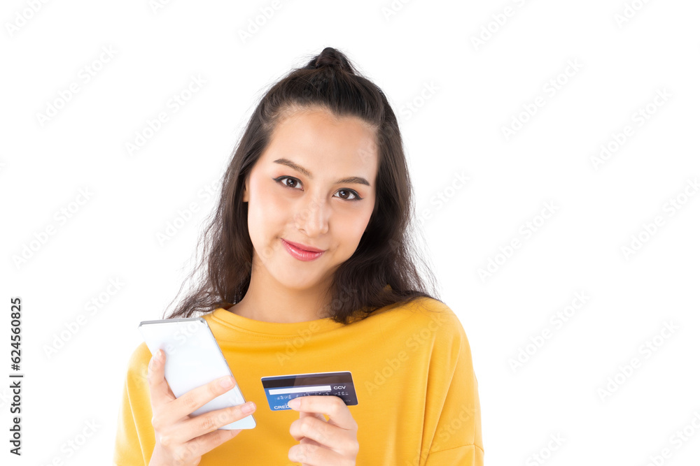 Young beauty Asian woman shopping payment online with credit card on smartphone and she wearing a ye