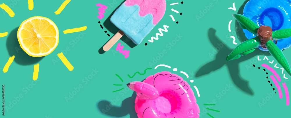 Summer concept with a flamingo float, lemon sunlight and a popsicle - flat lay