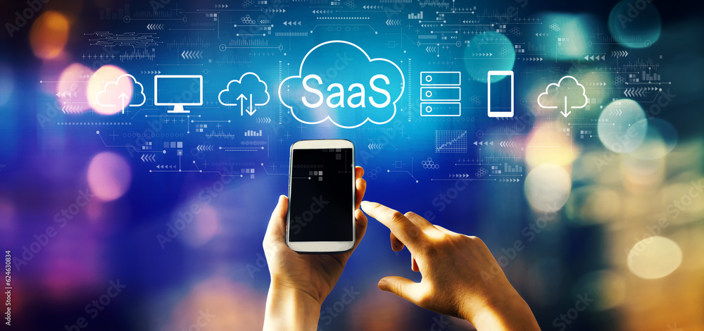 SaaS - software as a service concept with person using a smartphone