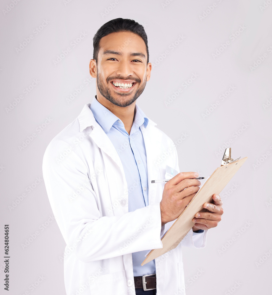 Portrait, smile and happy man doctor with checklist in studio for medical, compliance or insurance o