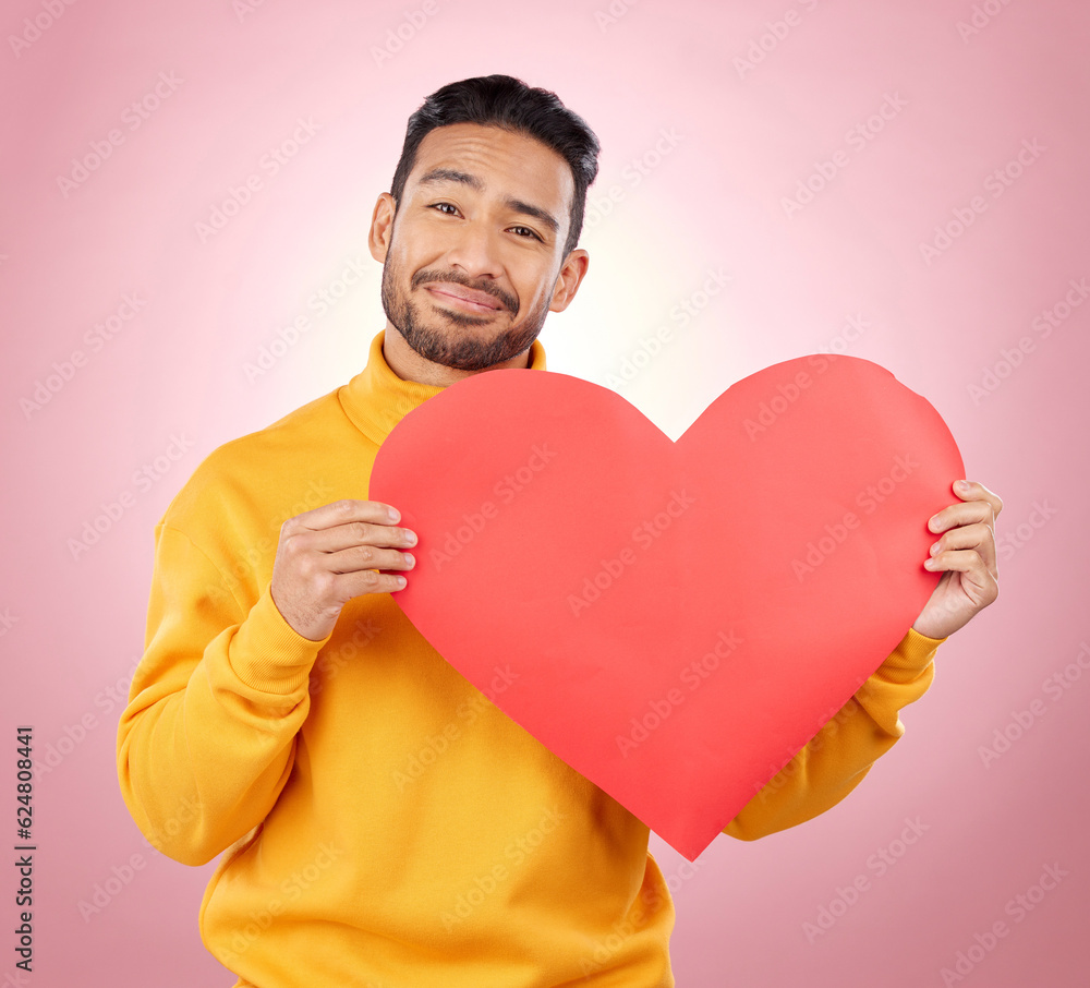 Heart, happy and love with portrait of man in studio for romance, date and valentines day. Kindness,