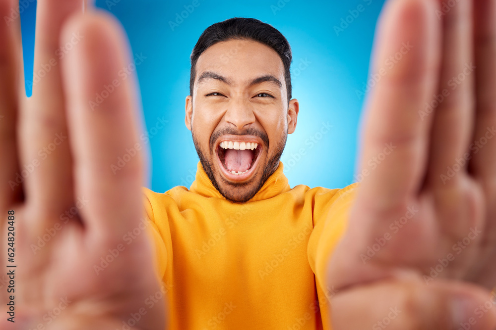 Selfie, excited and portrait of a man in studio with hands and shout emoji. Face of asian male or fa