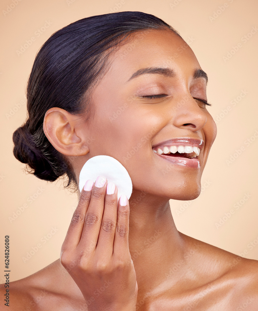 Happy woman, cotton pad and skincare of face cosmetics, aesthetic wellness and studio background. In