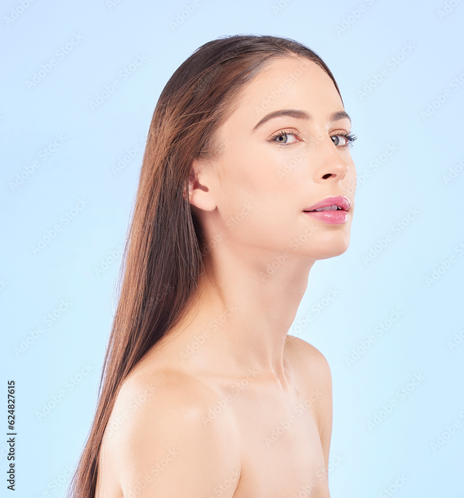 Portrait, beauty and hair with a model woman in studio on a blue background for skincare or keratin 