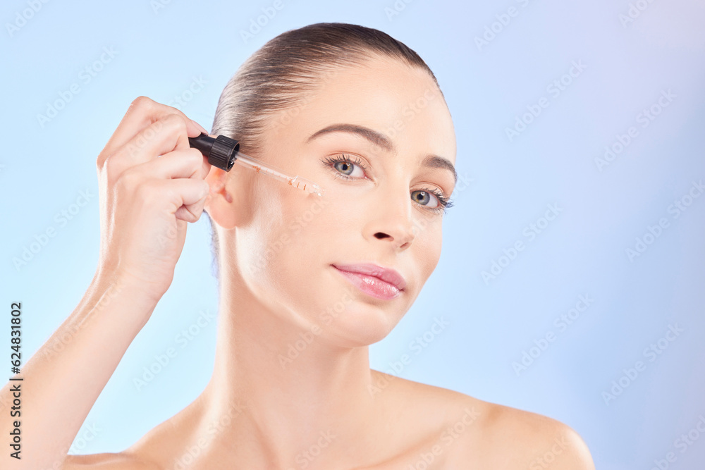 Woman, portrait and oil serum for face, aesthetic skincare and dermatology on blue background. Femal