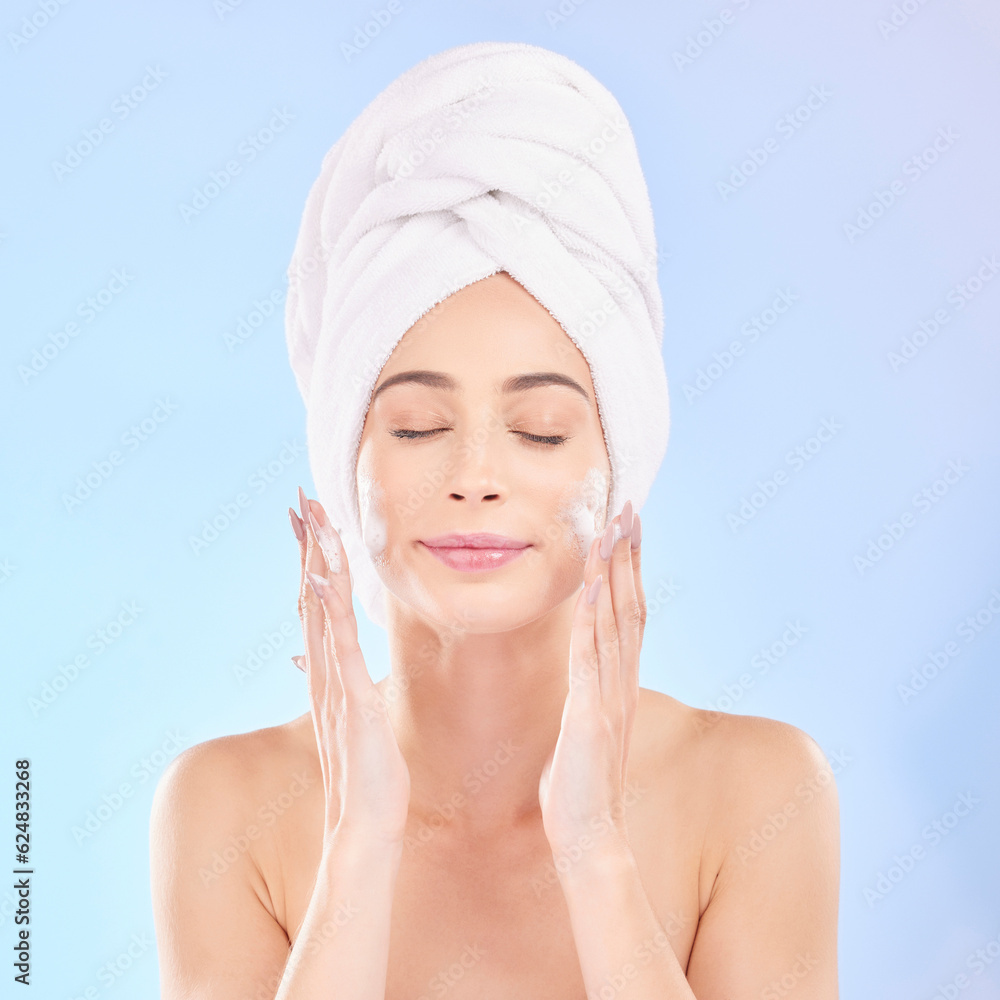 Face, skincare and woman with soap, towel and isolated in studio on a blue background. Eyes closed, 