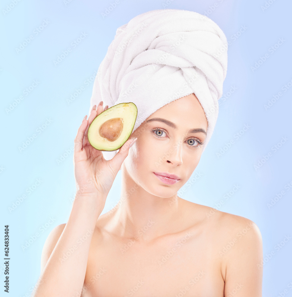 Woman, portrait and avocado, natural beauty and vitamin c with sustainable skincare isolated on blue