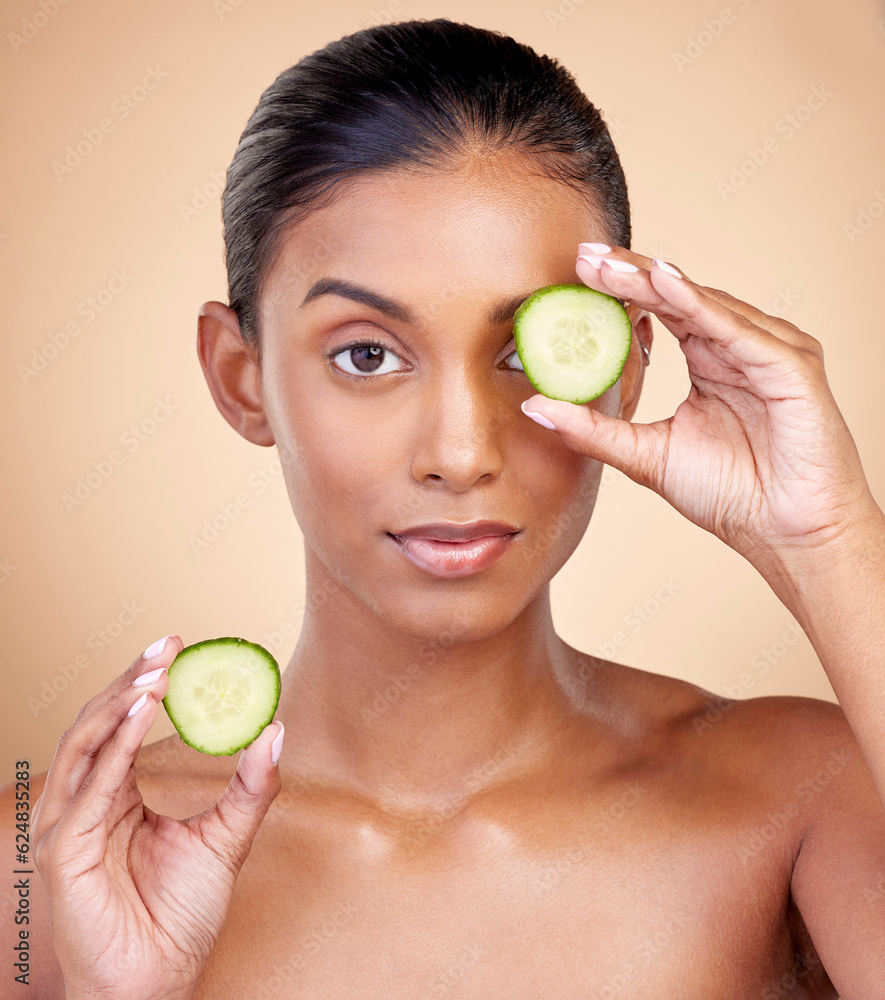 Cucumber, skincare and portrait of woman in studio, background or aesthetic shine. Face of indian fe