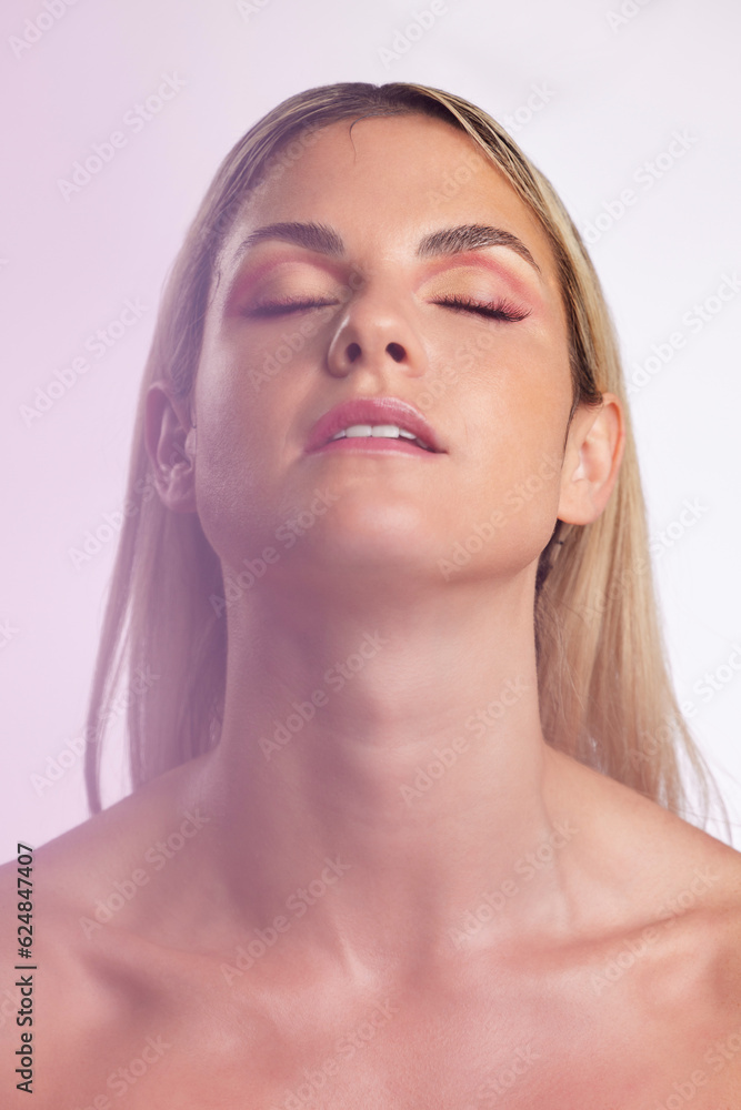 Face, beauty and skincare with a model woman in studio on a gray background in ambient lighting for 