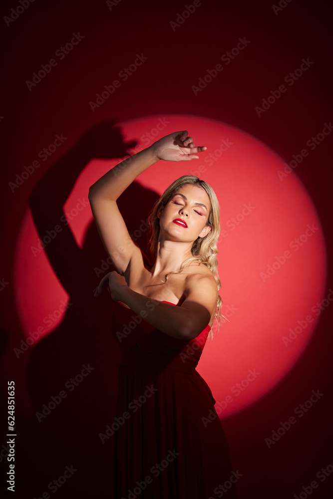 Vintage, fashion and a woman in a spotlight on a studio background for an art aesthetic. Creative, r