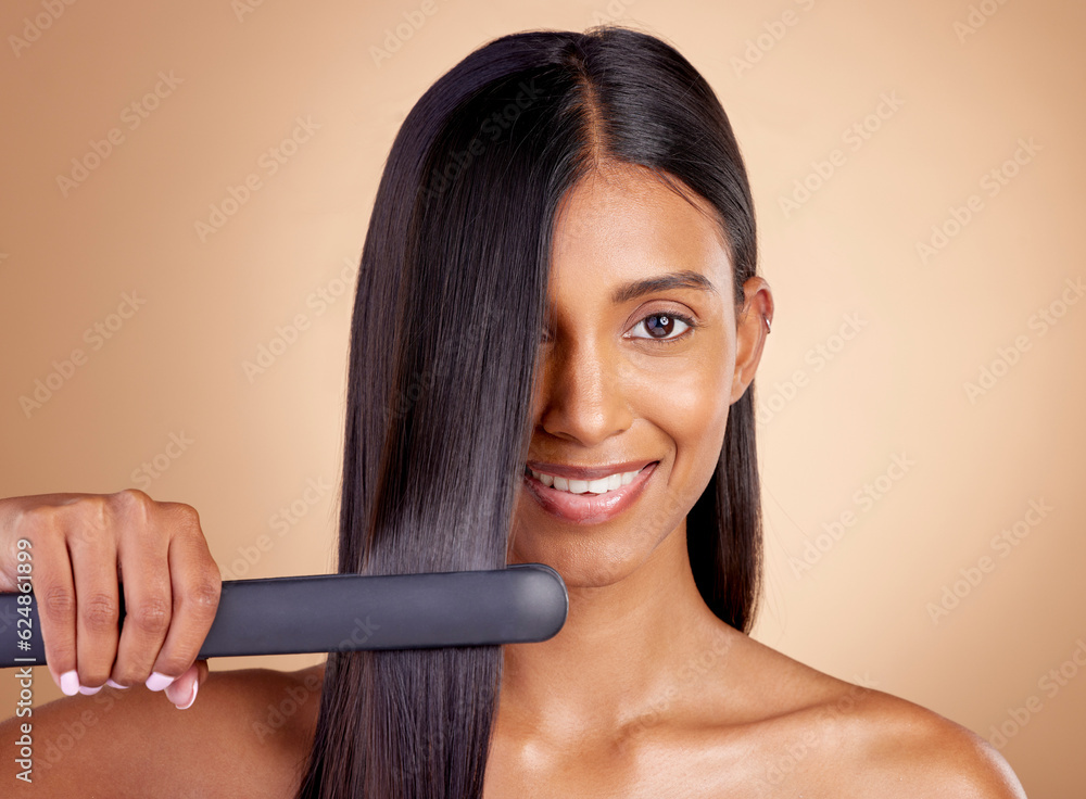 Portrait, hair and flat iron with a woman in studio on a beige background for beauty or style. Face,