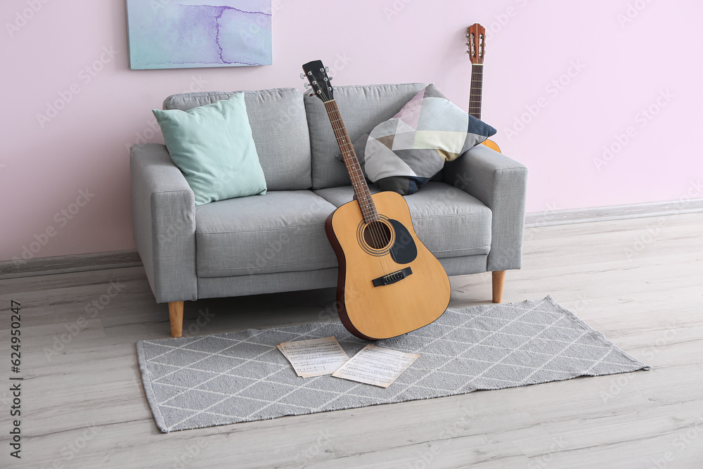 Interior of room with sofa and guitars