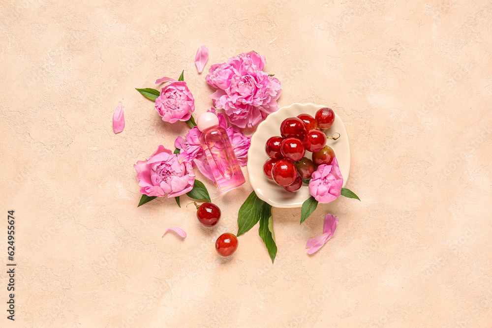 Composition with bottle of essential oil, grapes and peony flowers on color background