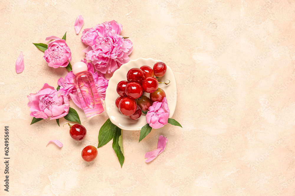 Composition with bottle of essential oil, grapes and peony flowers on color background