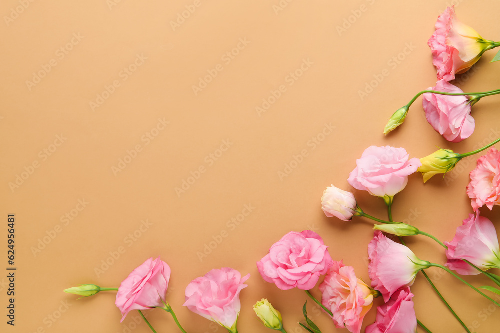 Beautiful pink eustoma flowers on brown background