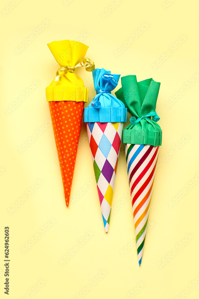 Colorful school cones on yellow background