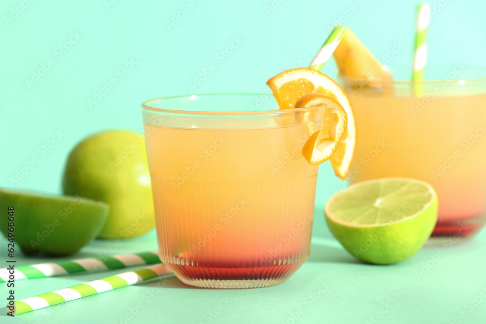 Glass of tasty mai tai cocktail on green background