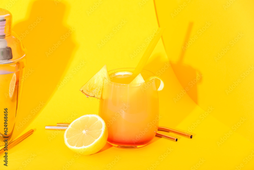 Glass of tasty mai tai cocktail on yellow background