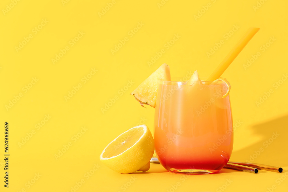 Glass of tasty mai tai cocktail on yellow background