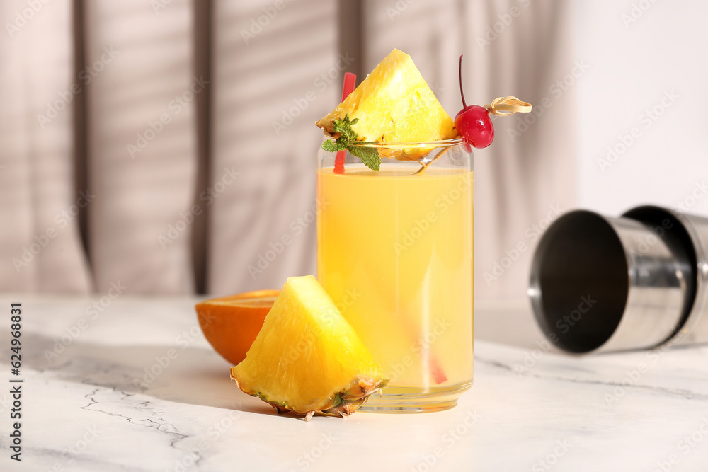 Glass of tasty mai tai cocktail on table