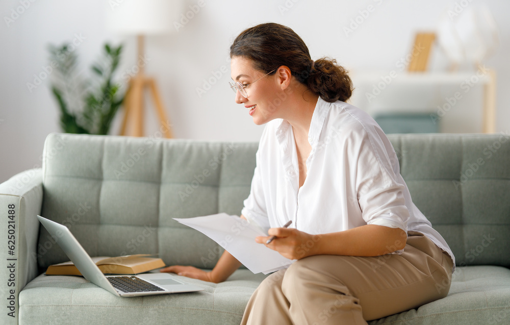 woman working on laptop at home