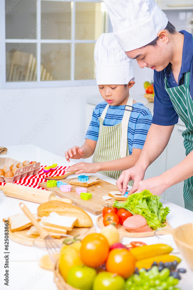 father and son cooking