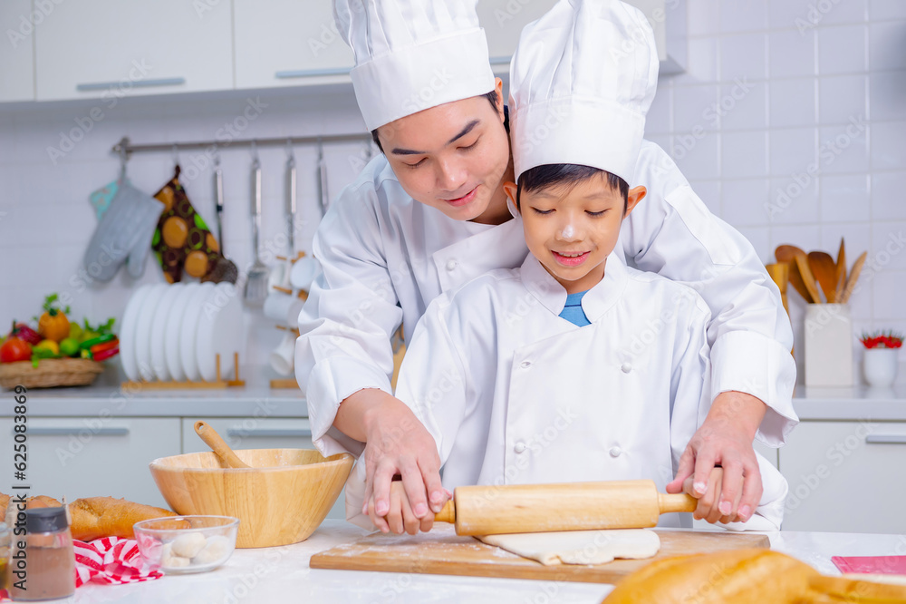 father and son cooking