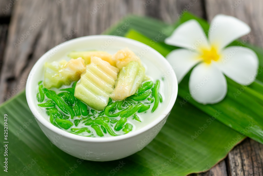 Close up of Lod Chong is a dessert made from rice flour. green from pandan leaves and fresh coconut 