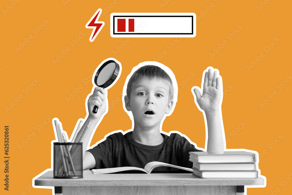 Tired little boy with magnifier sitting at desk against orange background