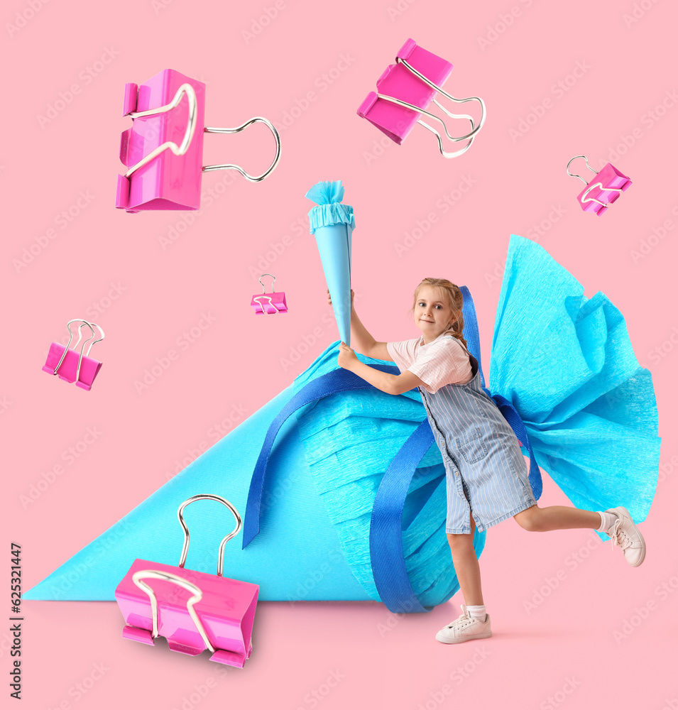 Cute little girl with blue school cone on pink background