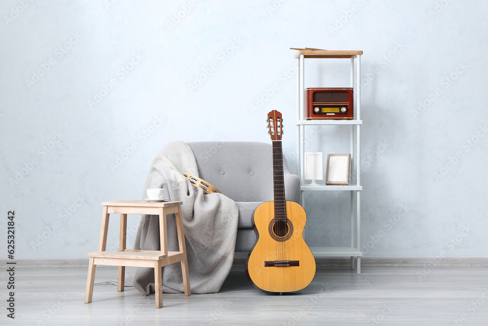 Interior of room with armchair and musical instruments