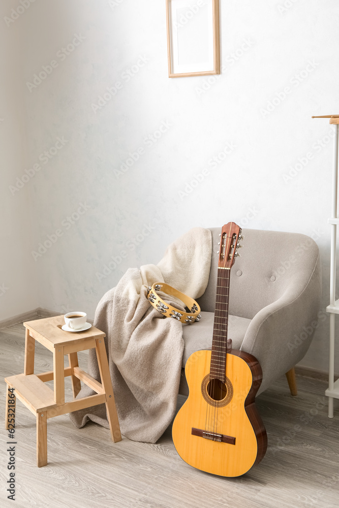 Interior of room with armchair and musical instruments