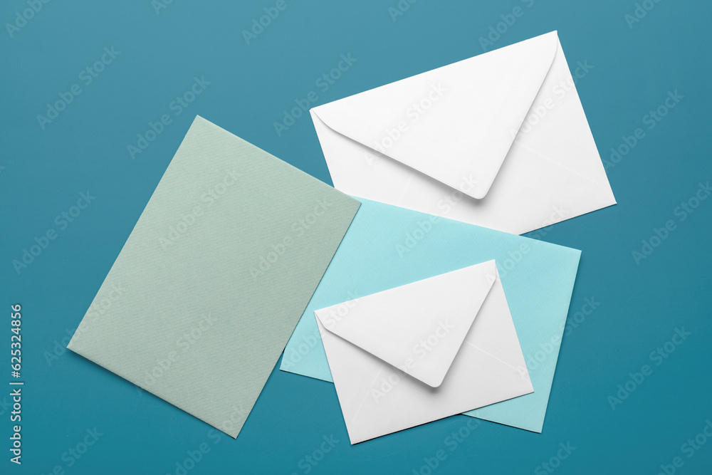 Set of different envelopes on color background