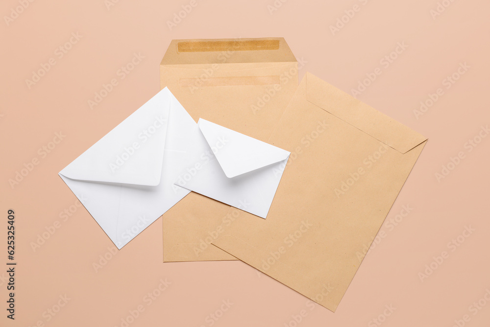 Set of paper envelopes on color background