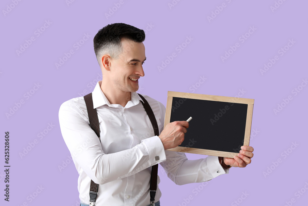 Male teacher with chalkboard on lilac background