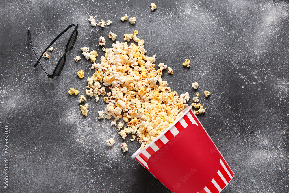 Bucket with tasty popcorn and 3D glasses on grey background