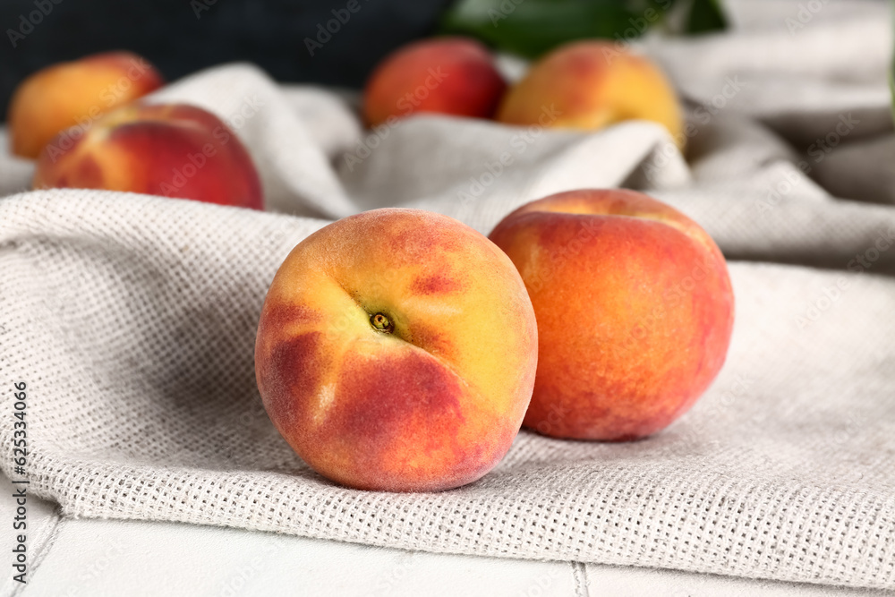 Sweet peaches on white tile table