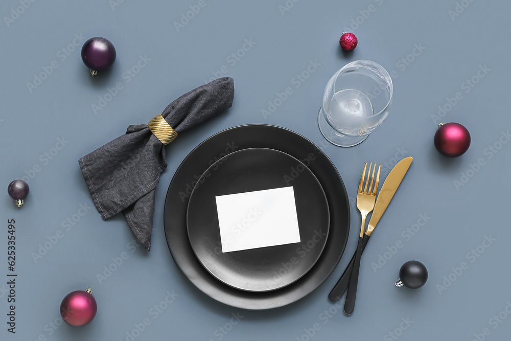 Beautiful table setting for Christmas celebration on grey background