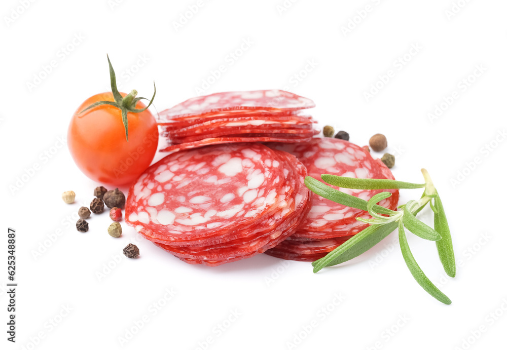 Slices of tasty salami with spices on white background