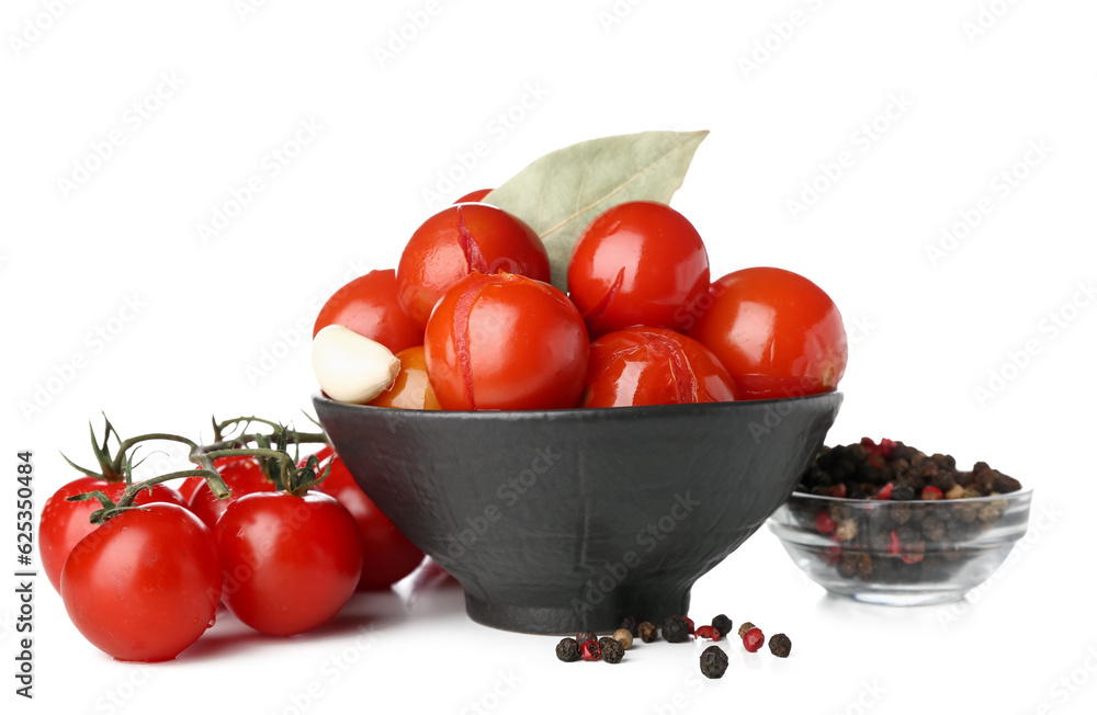 Bowl with canned tomatoes and peppercorn on white background