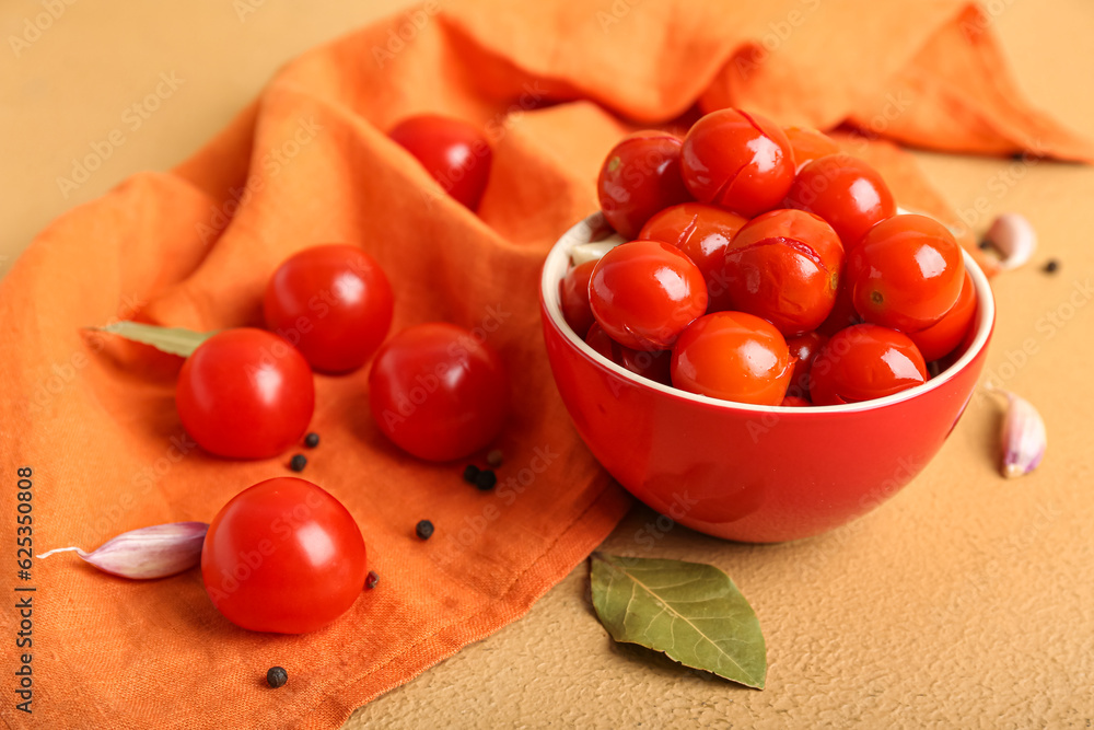 Bowl with canned tomatoes, peppercorn and garlic on beige background