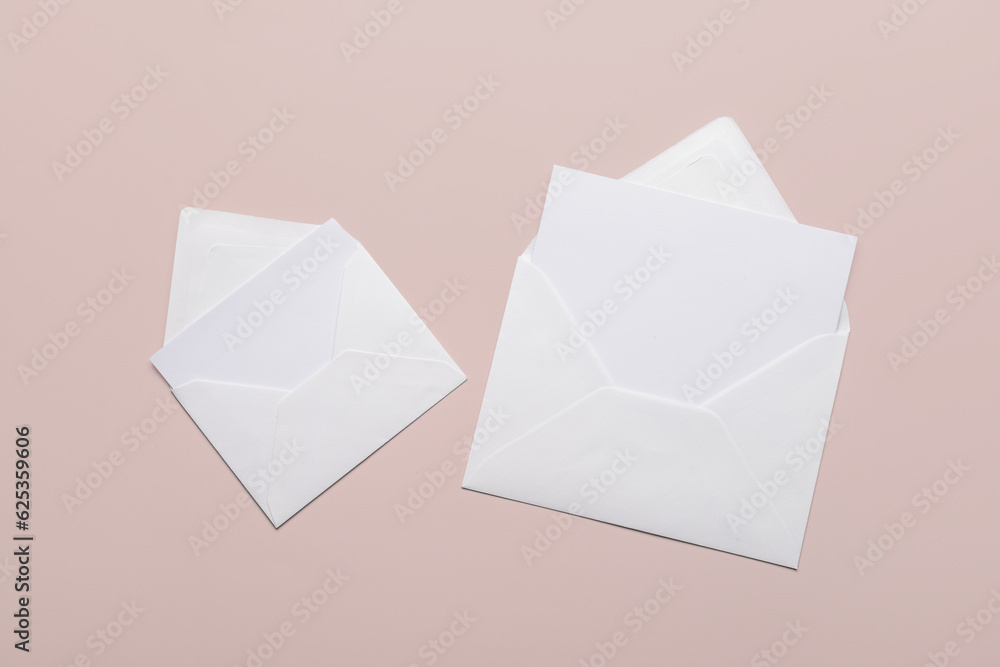 Paper envelopes with blank cards on color background