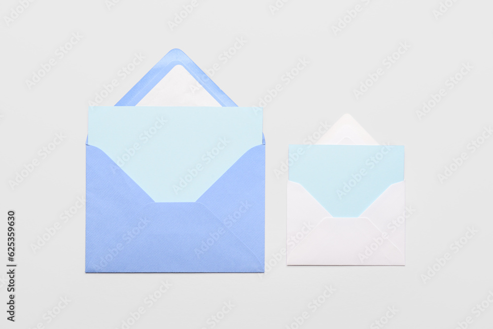 Envelopes with blank cards on white background