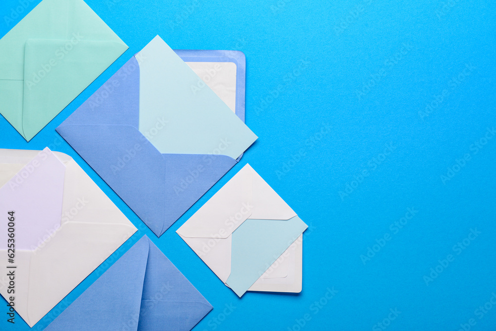 Set of envelopes with blank cards on color background