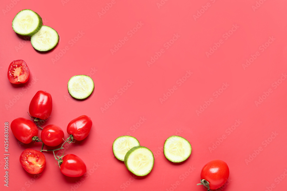 Frame made of different fresh vegetables on red background