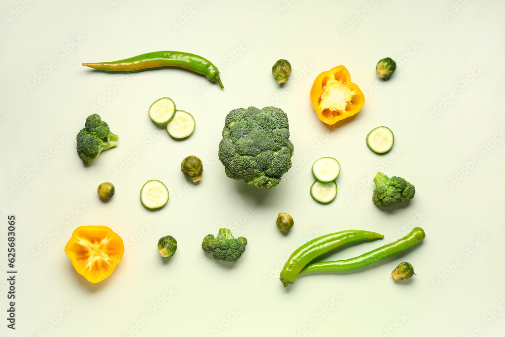 Different fresh vegetables on green background