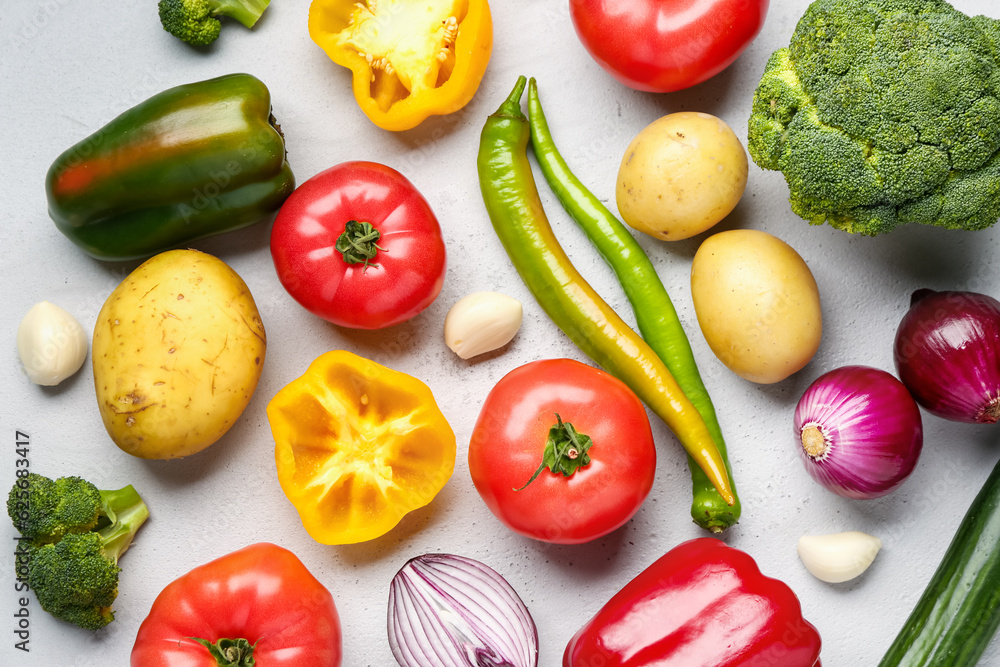 Different fresh vegetables on grey background